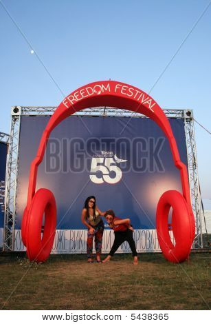 Two Girls Under Huge Headphones