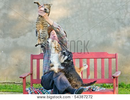 Man with cat and dogs