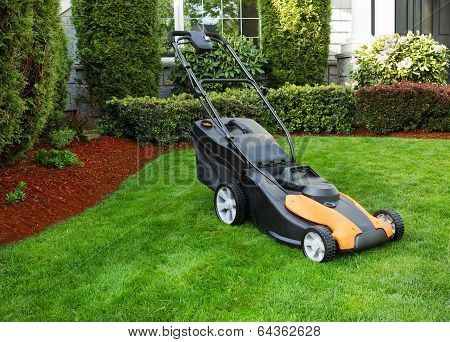 Electric Battery Lawn Mower On Front Yard