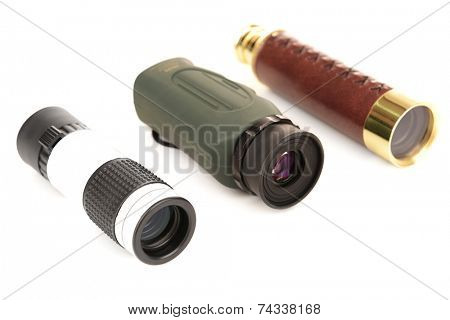 Modern monocular telescopes isolated on white