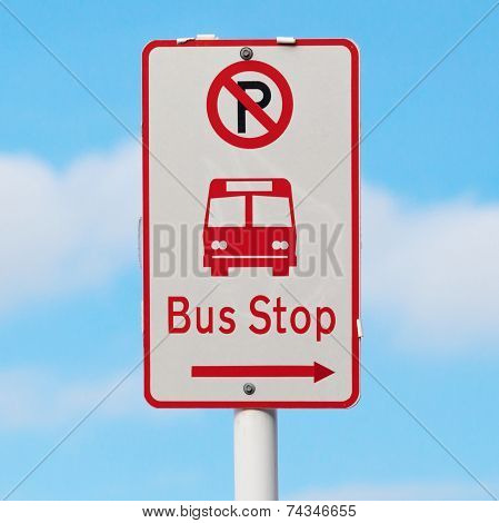 The Sign Shows Way To Bus Stop And No Parking Area With Blurry Blue Sky Background.