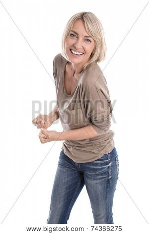Cheering happy older isolated blond woman in blue jeans and white teeth.