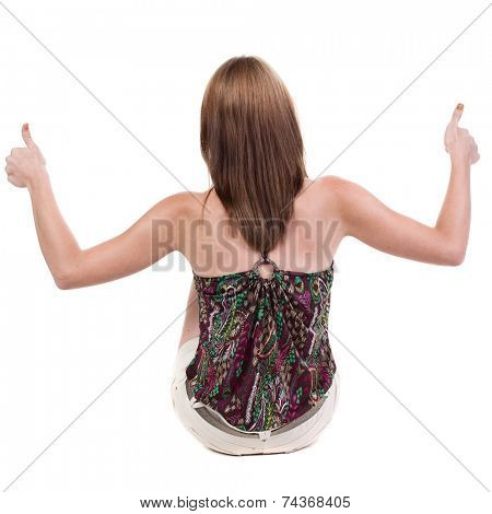 back view of siting young blonde  woman showing thumb up.  Rear view people collection.  backside view of person.  Isolated over white background