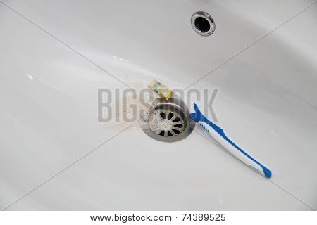 Blood and toothpaste on the toothbrush