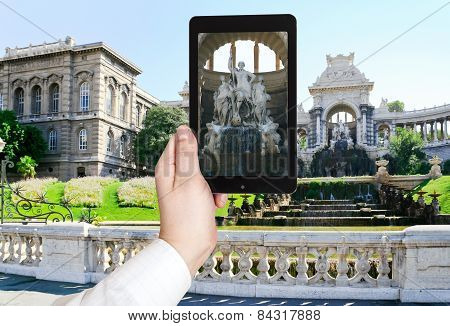 Tourist Taking Photo Of Palais De Longchamp