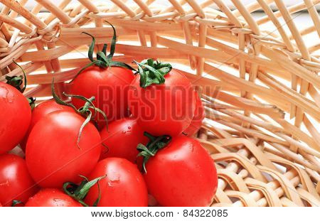 tomatoes in straw basket