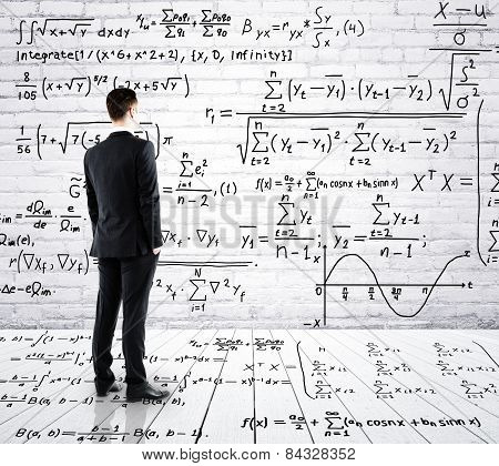 Businessman Looking At Formula