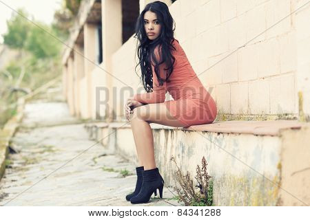 Hispanic Young Woman Wearing Casual Clothes In Urban Background