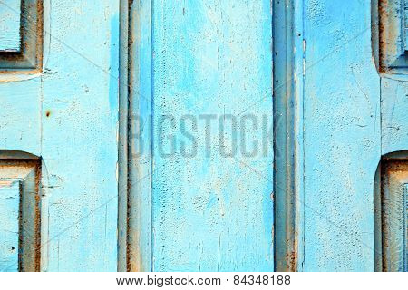 Stripped Paint In The Blue Wood Door And