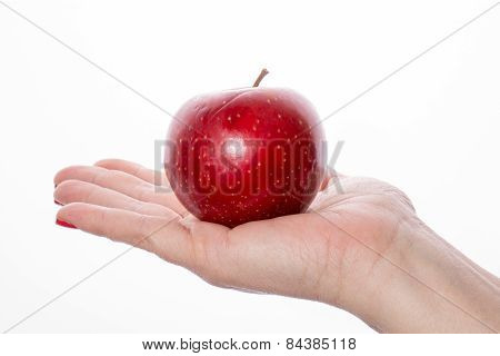 Woman's hand with red apple on white background