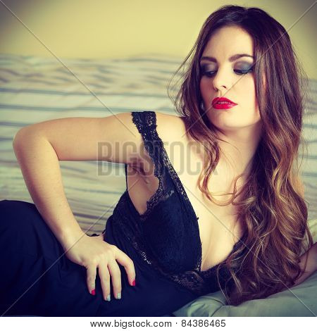 Seductive Woman In Lingerie On Bed.