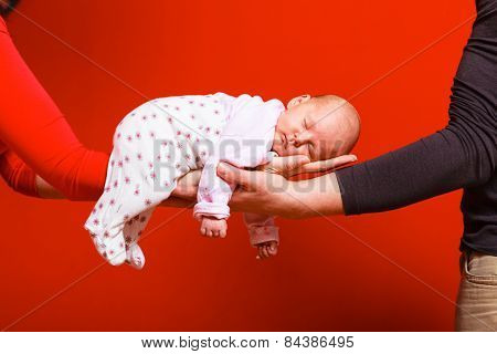 Newborn Baby Girl In The Comfort Of Moms Arms