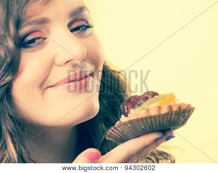 Woman Closed Eyes Holds Cake In Hand