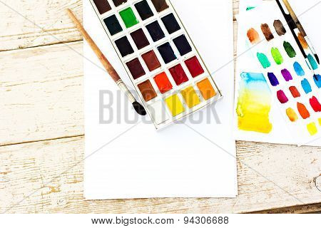Workplace artist - paper paint brushes color wheel