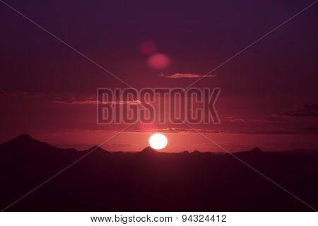 Sunset silhouette over the mountain