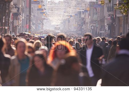 people crowd walking on busy street on daytime