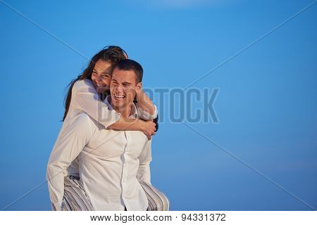 happy young romantic couple have fun relax smile at modern home outdoor terace balcony terace