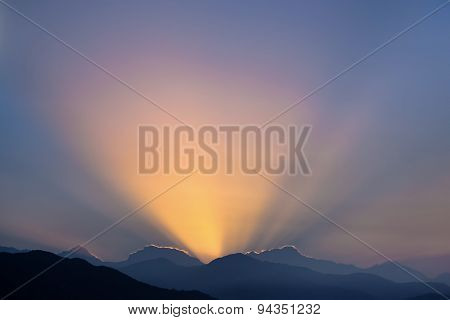 Sun Rising Over The Mountains.