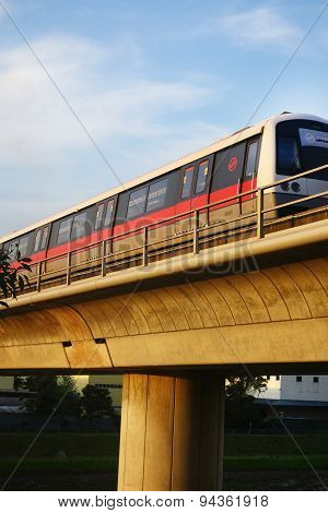 Singapore Mass Rapid Train (mrt) Travels On The Track