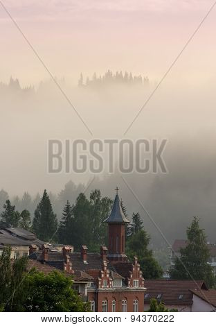 Roofed Houses Scene In The Mountain Fog.vladimir House From Vatra Dornei