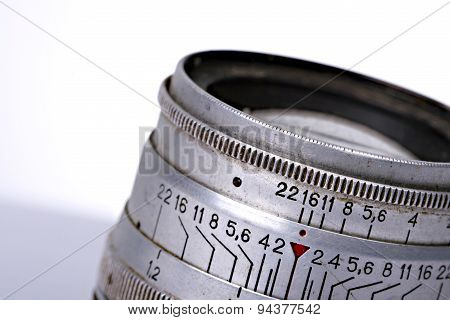 Picture of a Vintage dirty lens of camera on white background