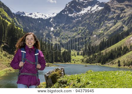 Woman Hiking By Lake