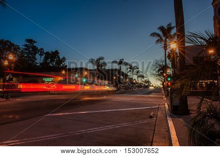 Editorial of streaking headlights going past Starbucks on Main Street in Ventura at dawn on October 22, 2016.