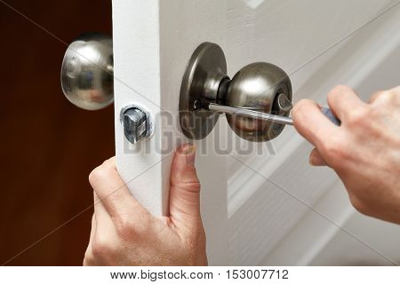 Door knob installation.