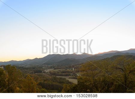 panoramic sunset on North Georgia Mountains facing homes in Dillard Georgia with lots of negative space