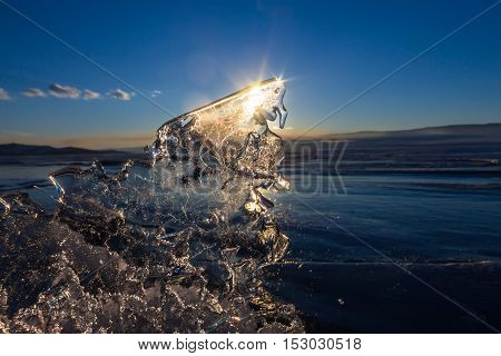 Sun At Sunset Shining Through The Transparent Texture Of The Ice