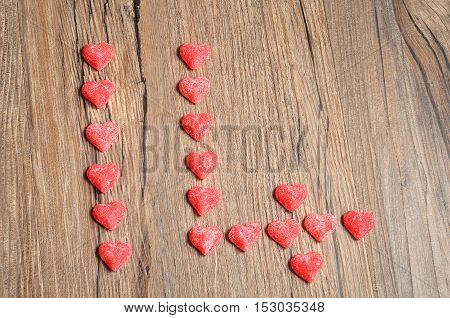 Fourteen made out of sugarcoated heart shape candy for valentines day