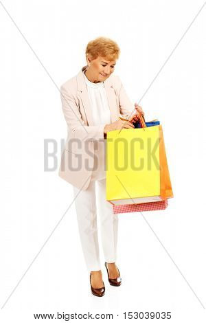 Happy business woman holging shopping bags