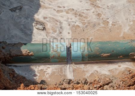 repair the plumbing broken pipe and water flow in hole.