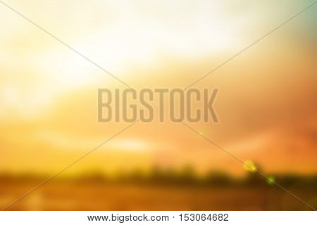 Natural background blurring.warm colors and bright sun light. bokeh background or Christmas background.Green Energy.warm sky sunny color green light patterns plain abstract flare evening clouds blur