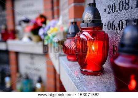 Candles Burning At A Cemetery