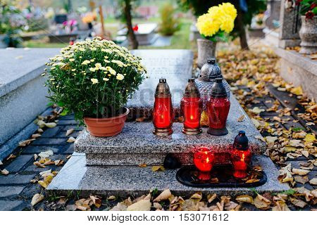 Candles Burning At A Cemetery