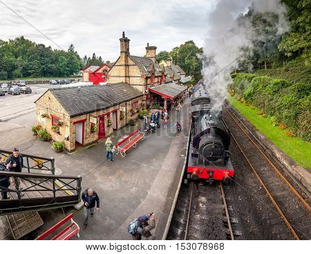 Tourists waiting at Haverthwaite Station part of Lakeside and Haverthwaite Railway. 4 image panorama: Haverthwaite, Cumbria, England, UK. October 4, 2016.