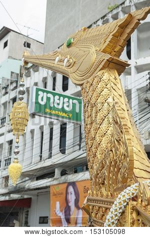 Suratthani, Thailand - October 20, 2016: Details on ornamented carriers of Buddha images to be pulled across the city during the famous Chak Phra Festival, an annual Buddhist festival to celebrate the return of Buddha from heaven to earth after the end of