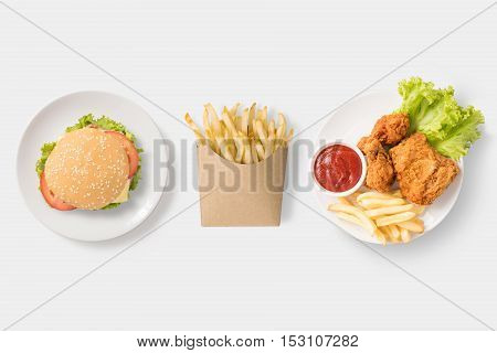 Concept Of Mock Up Burger, French Fries And Fried Chicken Set Isolated On White Background. Copy Spa