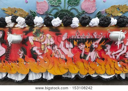 Suratthani, Thailand - October 20, 2016: Details on ornamented carriers of Buddha images to be pulled across the city during the famous Chak Phra Festival, an annual Buddhist festival to celebrate the return of Buddha from heaven to earth after the end of
