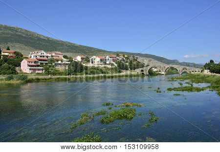 Arslanagica Most over Trebisnjica River in Trebinje Bosnia also known since 1993 as Perovica Bridge. Built by Ottomans in 1574 it was moved and physically rebuilt in 1970 a few kilometres from its orginal location.