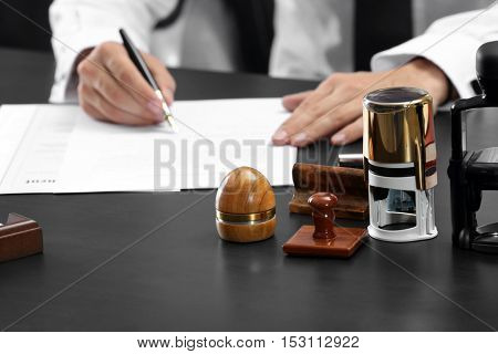 Stamps and ink pad on notary table