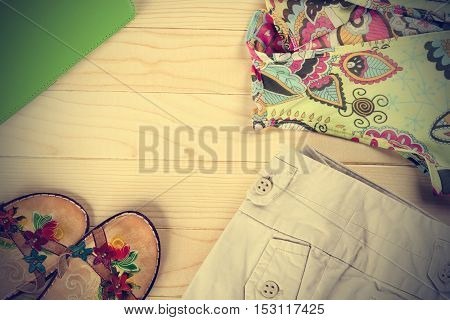 Women outfit on an old wooden table