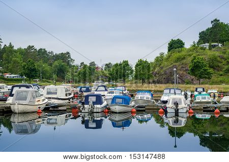 Small fishing boats at Falkensten village camping. Norway.