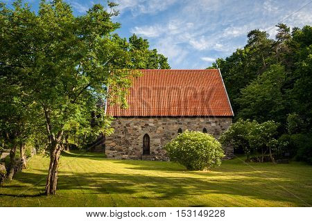Lovoy medieval chapel on the famous spring's water source, nordic pilgrimage site. Falkensten, Norway.