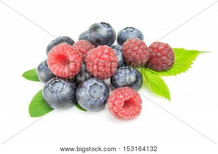 Ripe raspberry with blueberry isolated on white.