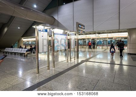 HONG KONG - CIRCA JANUARY, 2016: inside MTR station in Hong Kong. MTR is the rapid transit railway system in Hong Kong. It is one of the most profitable systems in the world