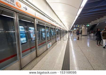 HONG KONG - CIRCA JANUARY, 2016: inside MTR station in Hong Kong. MTR is the rapid transit railway system in Hong Kong. It is one of the most profitable systems in the world