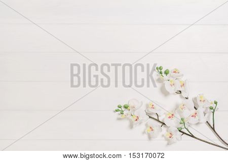 Feminine, elegant woman's white, wooden table, desk or workspace seen from above. Top view background with copy space. Creative workspace for freelance girl working from home