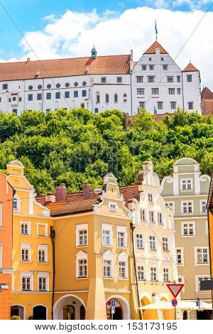 Street view with colorful bavarian houses and Trausnitz castle in Landshut old town, Germany
